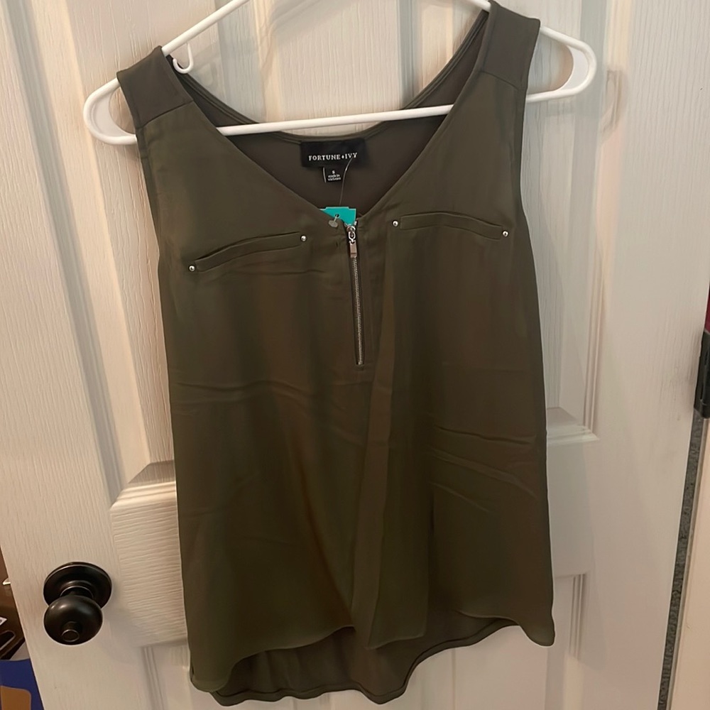 Brand new Small and lite women’s blouse. Olive green and perfect.